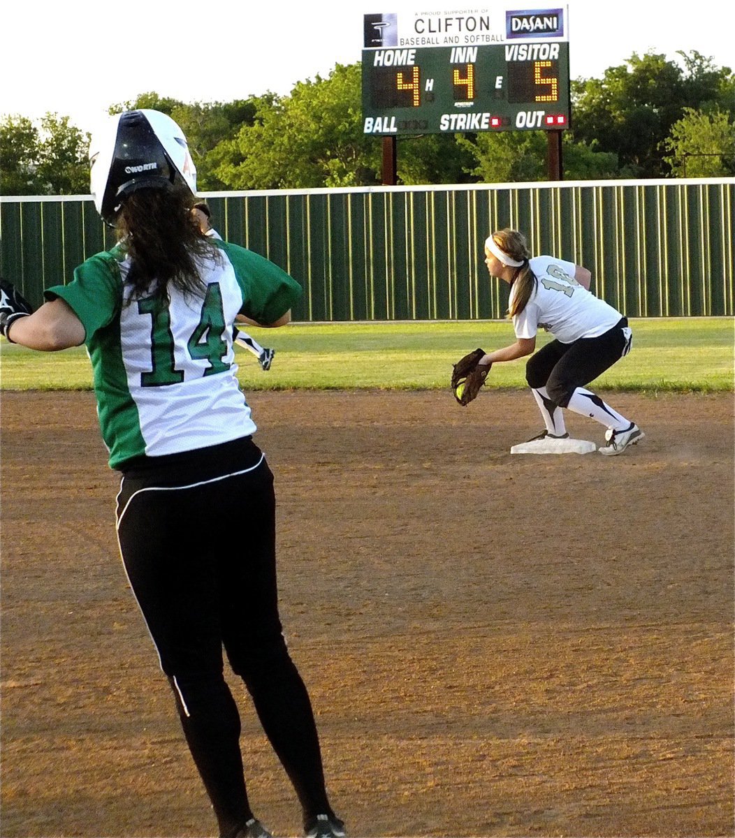 Image: Second baseman, Paige Westbrook(10) holds clifton to a single.