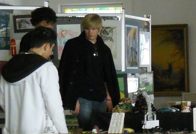 Image: Gus, Austin, and Joseph study other works of art for ideas for next year.