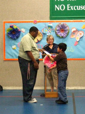 Image: This third grade student was proud to accept his award.