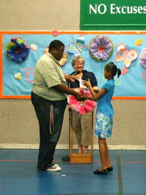 Image: Another proud third grader accepts her award.