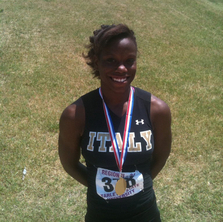 Image: Kortnei Johnson is #1 — After receiving her first place medal in the 100m dash in Stephenville at the regional track meet.