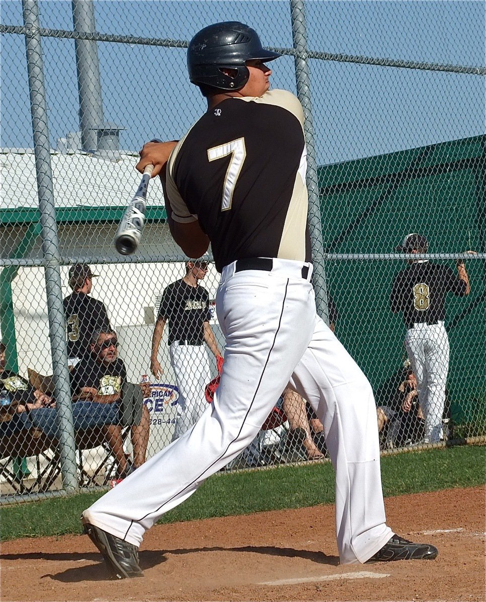 Image: Italy senior, Omar Estrada(7), takes a swing at the Rio Vista Eagles.