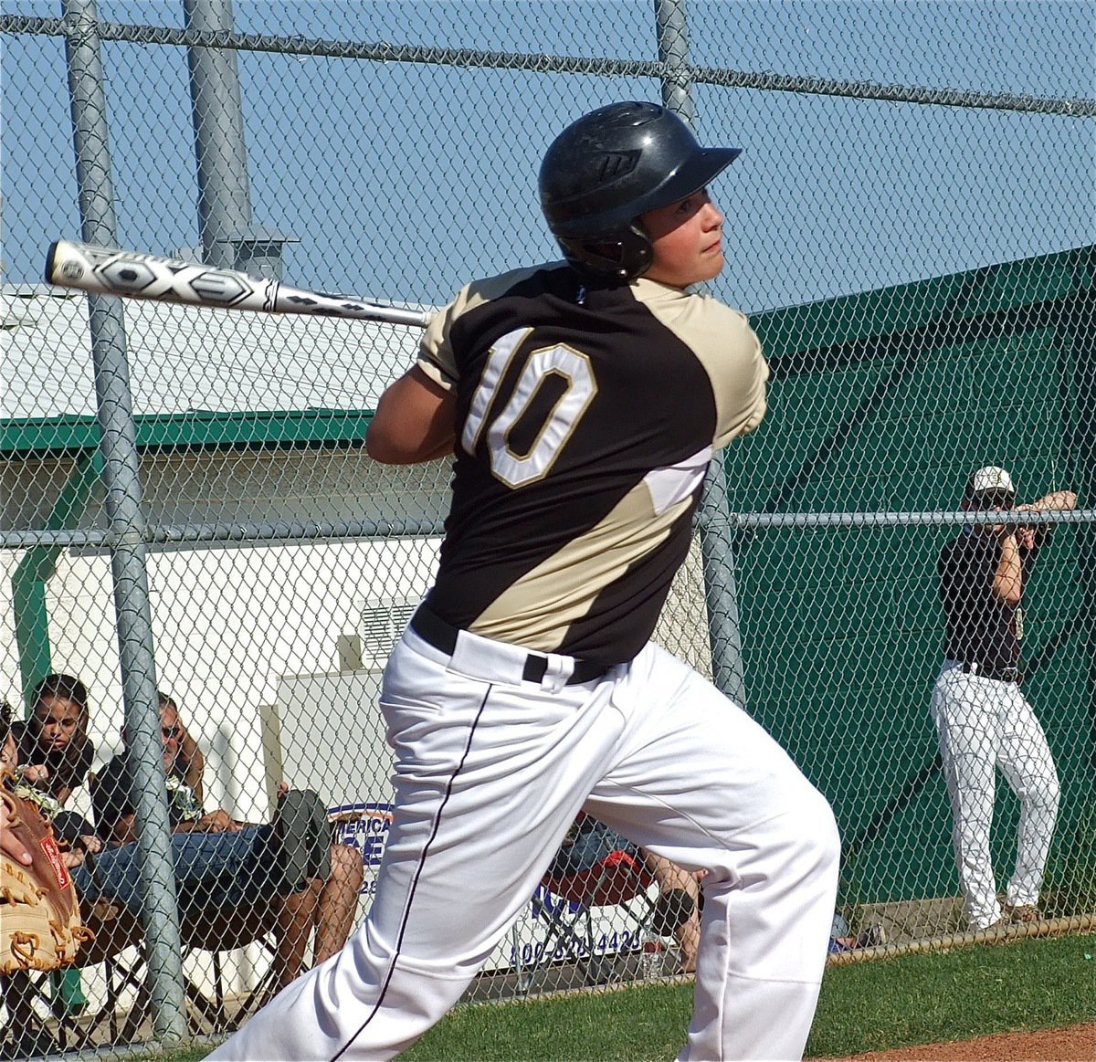 Image: Taking a mighty swing is JV Gladiator, Zain Byers(10).