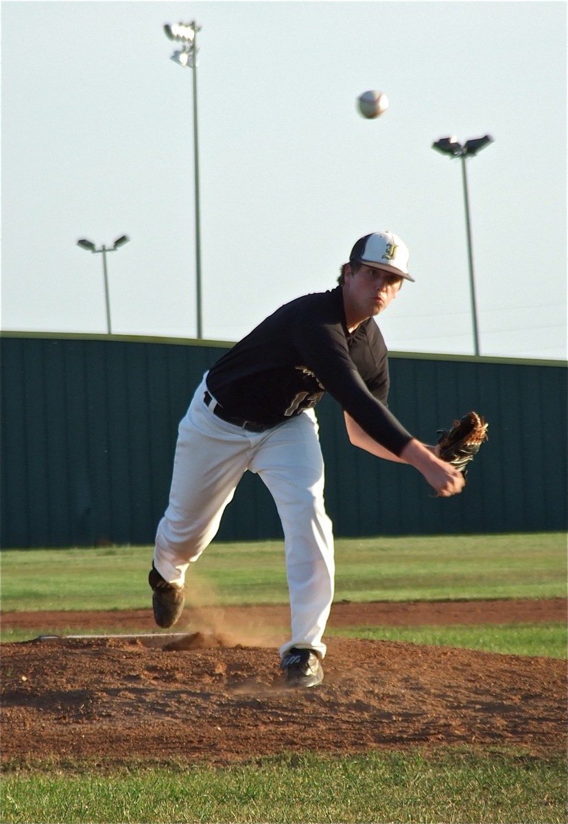 Image: Senior pitcher, Justin Buchanan(13), takes the mound during his final game as a Gladiator despite an injured shoulder.