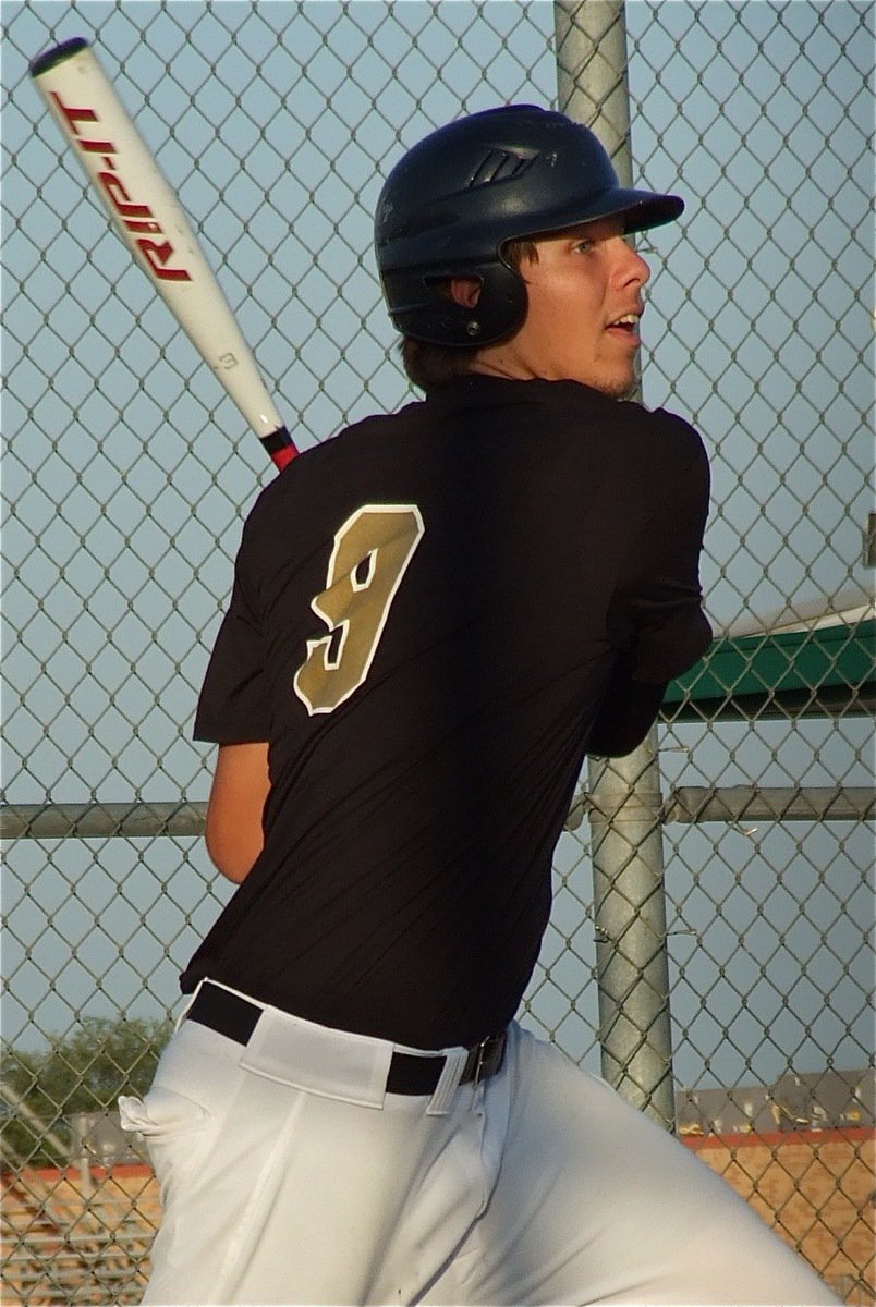 Image: Junior Gladiator, Cole Hopkins(9), rips it toward Eagle defenders.