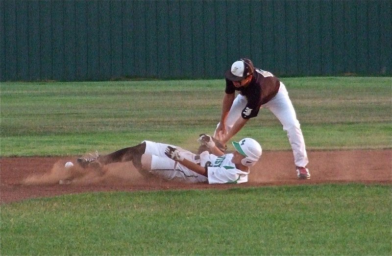 Image: Reid Jacinto(5) attempts to make a tag at second base.