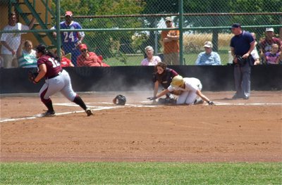 Image: Jaclynn Lewis(15), collides with Mildred’s catcher and then reaches for home plate to pull Italy within 1-run of the Lady Eagles, 2-1. Lewis was followed in by teammate, Alyssa Richards, who tied the game 2-2 after her sister, Megan Richards, hit the 2RBI triple.