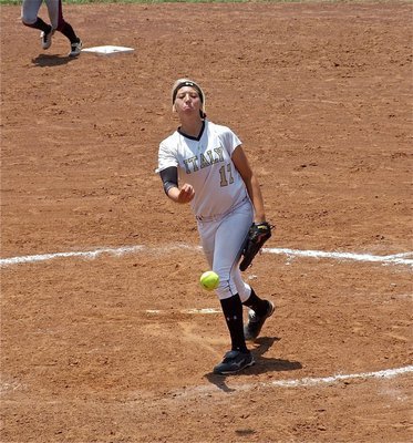 Image: Injured pitcher, Megan Richards(17), takes the mound to give starting pitcher, Jaclynn Lewis, time to refresh.