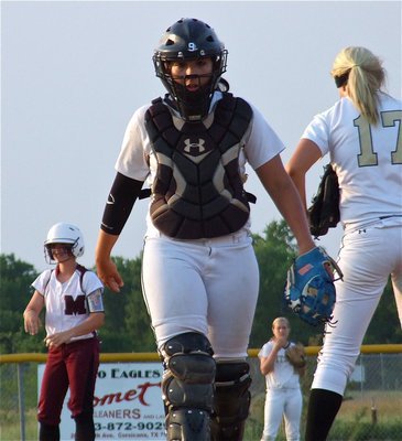 Image: Catcher, Alyssa Richards, the intimidating one, checks on her pitcher which is also her sister, Megan Richards(17).