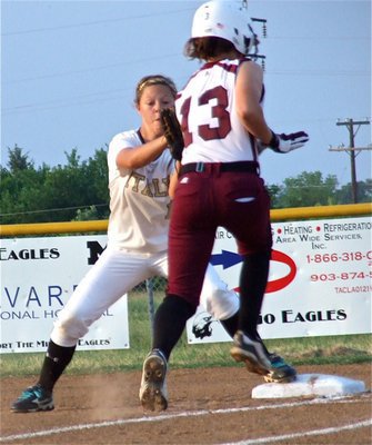 Image: Lady Gladiator second baseman, Bailey Eubank(11), makes the tag against a Mildred runner while covering first base.