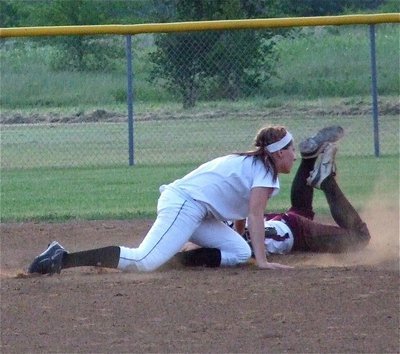 Image: Bailey Bumpus, also a senior Lady Gladiator, tries to make a tag for an out at second base.