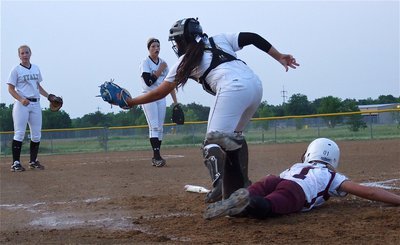 Image: Mildred slides in for the first tun of the game before Alyssa RIchards(9) can make the tag.