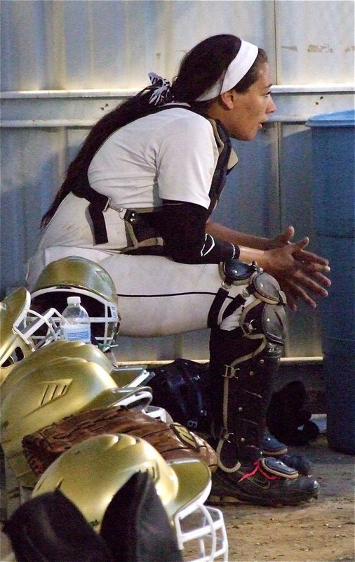Image: The “Bone Crusher,” Alyssa Richards(9), takes a moment to rest in Italy’s dugout. 