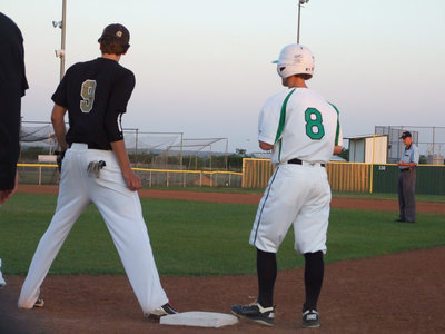 Image: Cole Hopkins guards first base.