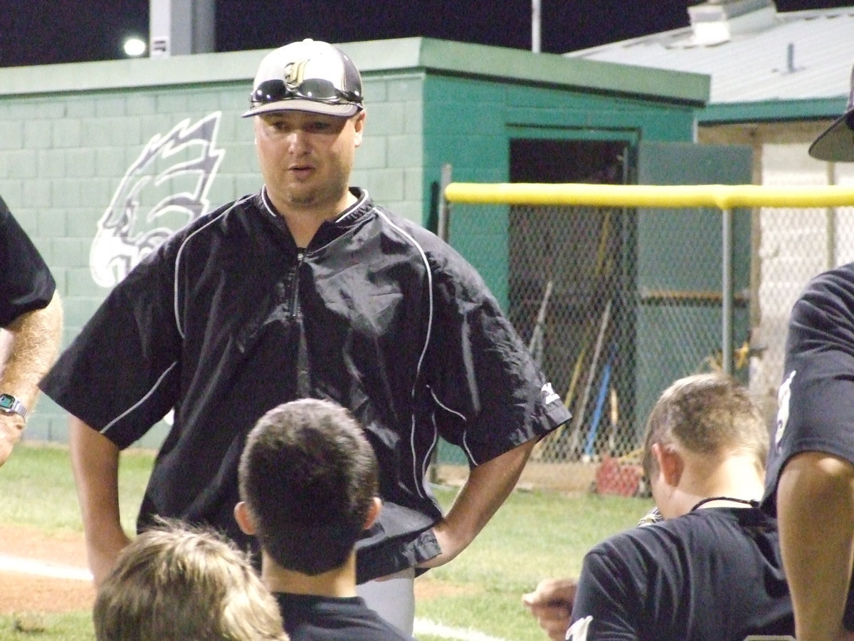 Image: Coach Josh Ward talks to his team.