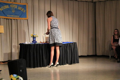 Image: Kaitlyn Rossa (senior) lights the “Scholarship” candle.
