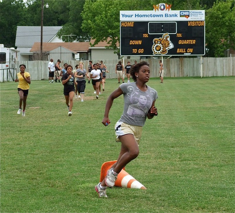 Image: Lady Gladiator freshman, Kortnei Johnson, gets a lap in around Willis Field before taking her skills to the state track meet.