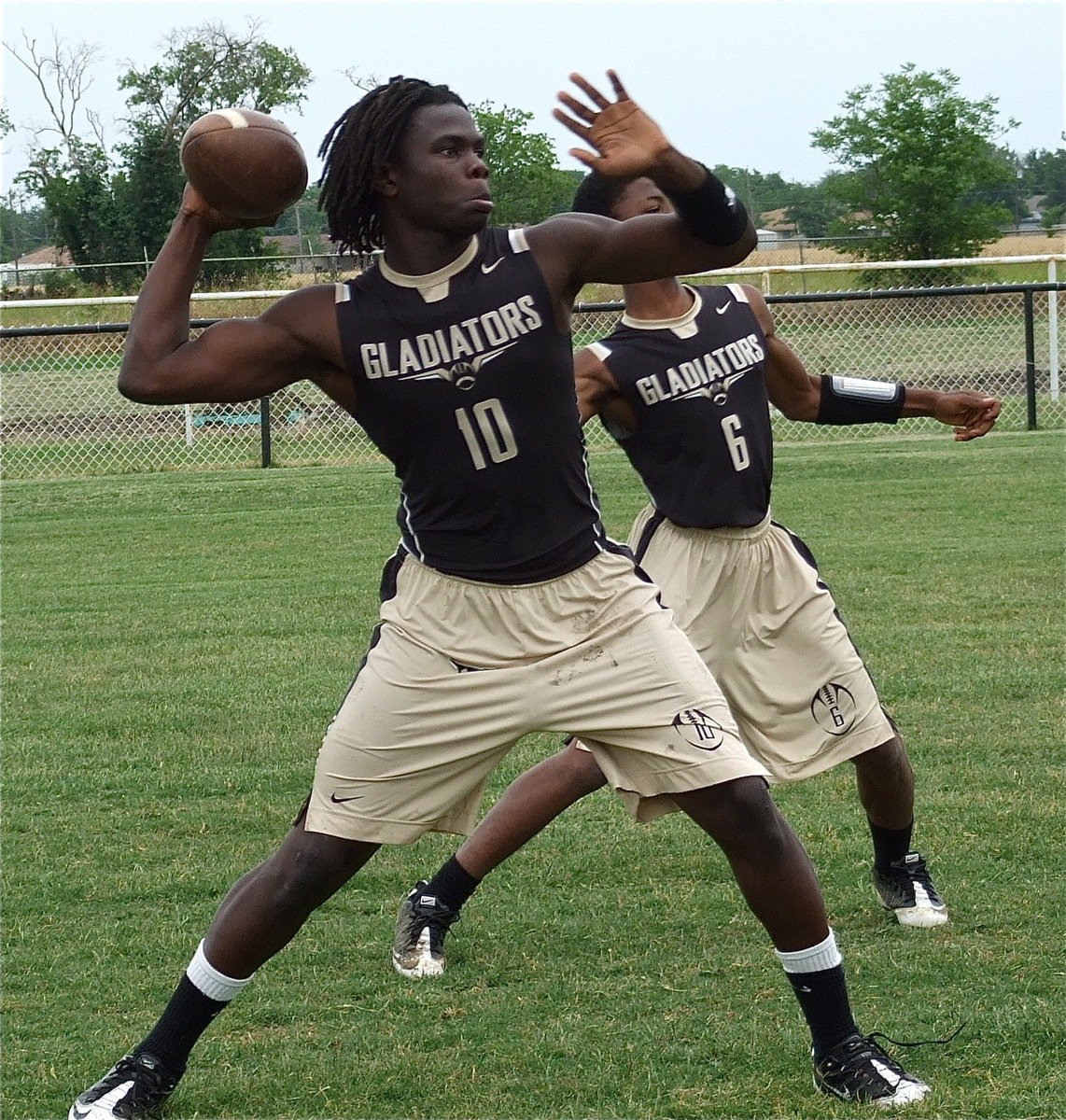 Image: Ryheem Walker(10) and Eric Carson(6) take reps at the quarterback position.