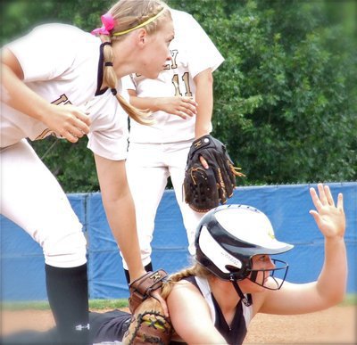 Image: Jaclynn Lewis(15) keeps a Lady Pirate beached at first base.