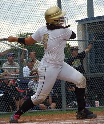 Image: Italy’s Alyssa Richards(9) clears the fence but the ball floats foul against the Lady Pirates.