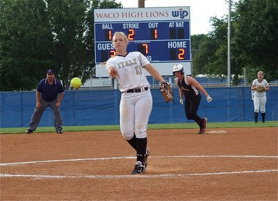 Image: Freshman pitcher, Jaclynn Lewis(15), attacks the Pirates from the mound.