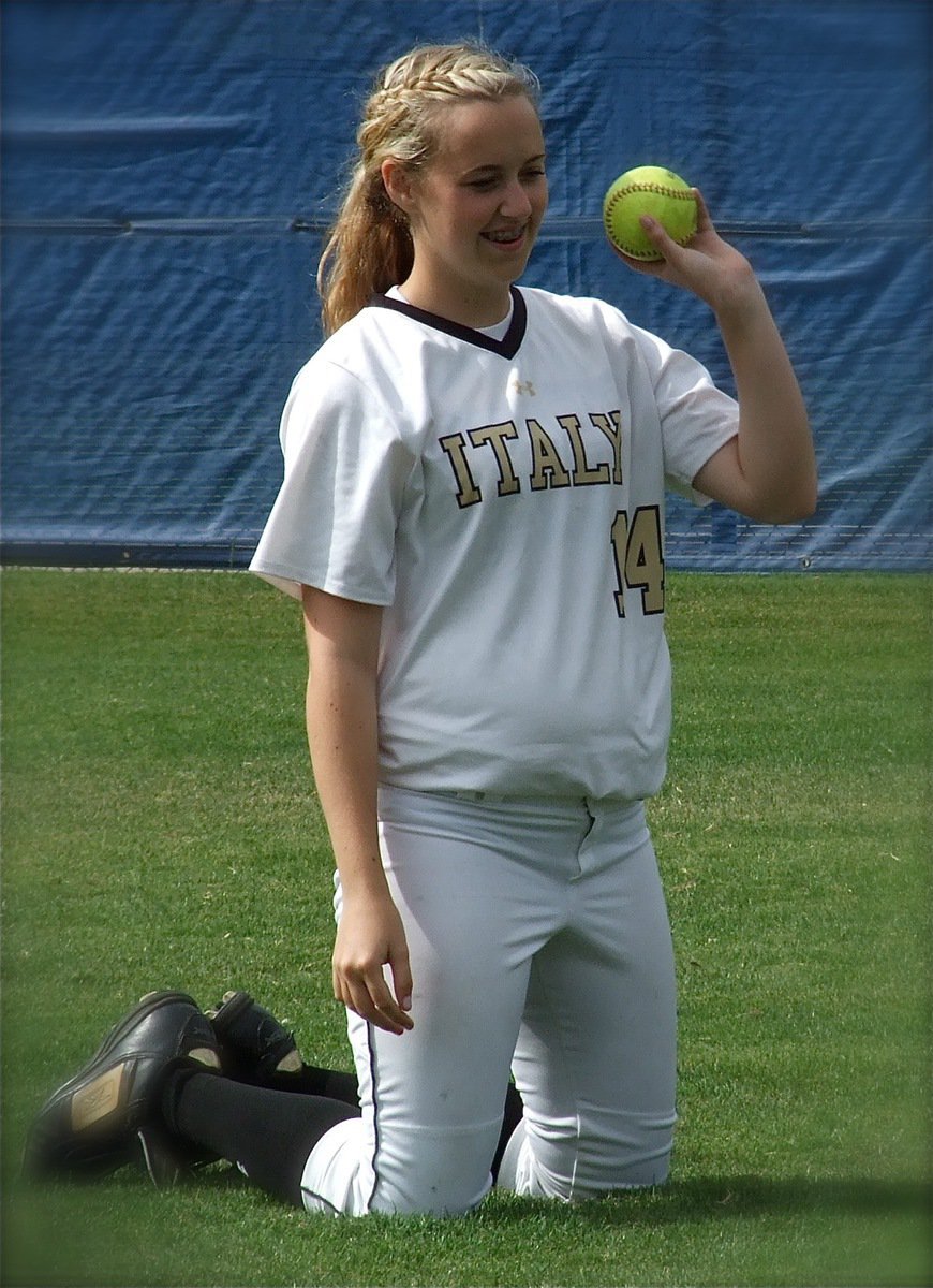 Image: Kelsey Nelson(14) works a softball skills drill before the regional game 1 against Crawford.
