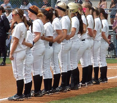 Image: The Lady Gladiators stand united during the National Anthem.