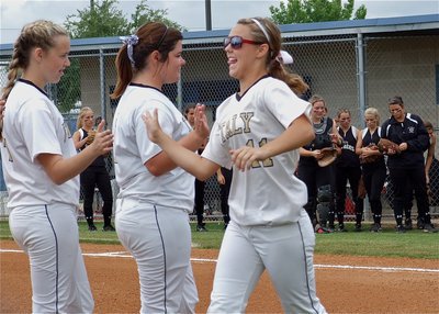Image: Freshman Bailey Eubank(11) gets introduced and then high fives Bailey DeBorde(1) and Kelsey Nelson(14) who are both freshman as well.