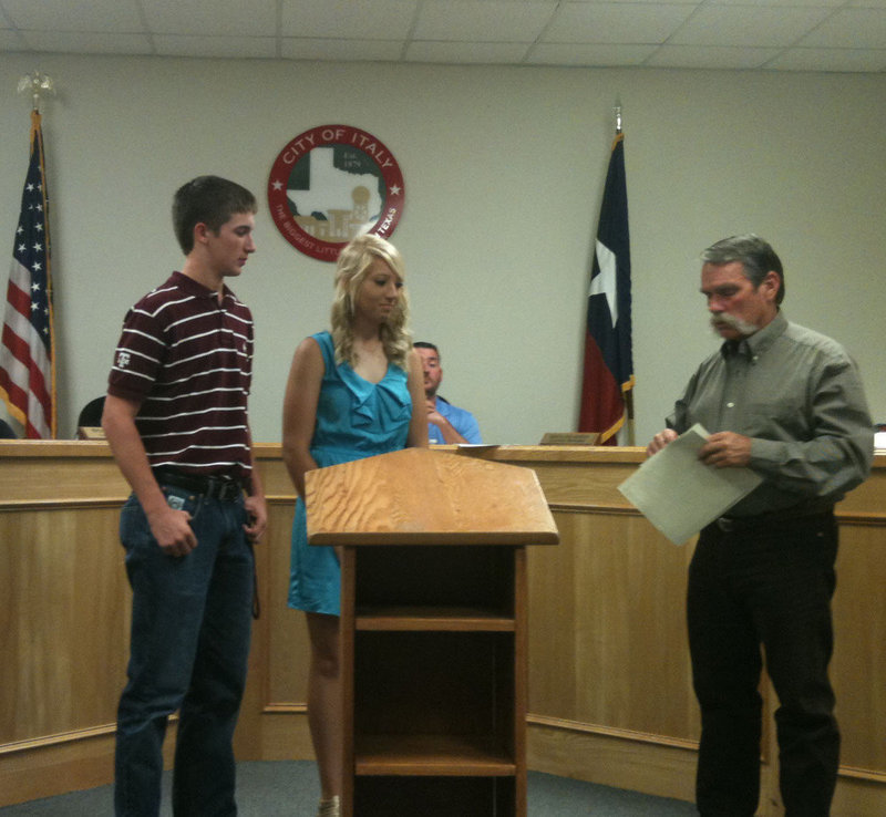 Image: Ross Stiles and Megan Richards receiving $500 scholarships from Jack Bingham, DCI Sanitation manager.