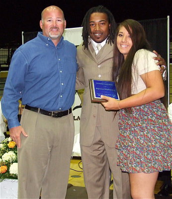 Image: Bryan Irwin and Keith Davis present the coveted Keith Davis Award to Lady Gladiator, Alyssa Richards, a junior at Italy High School.