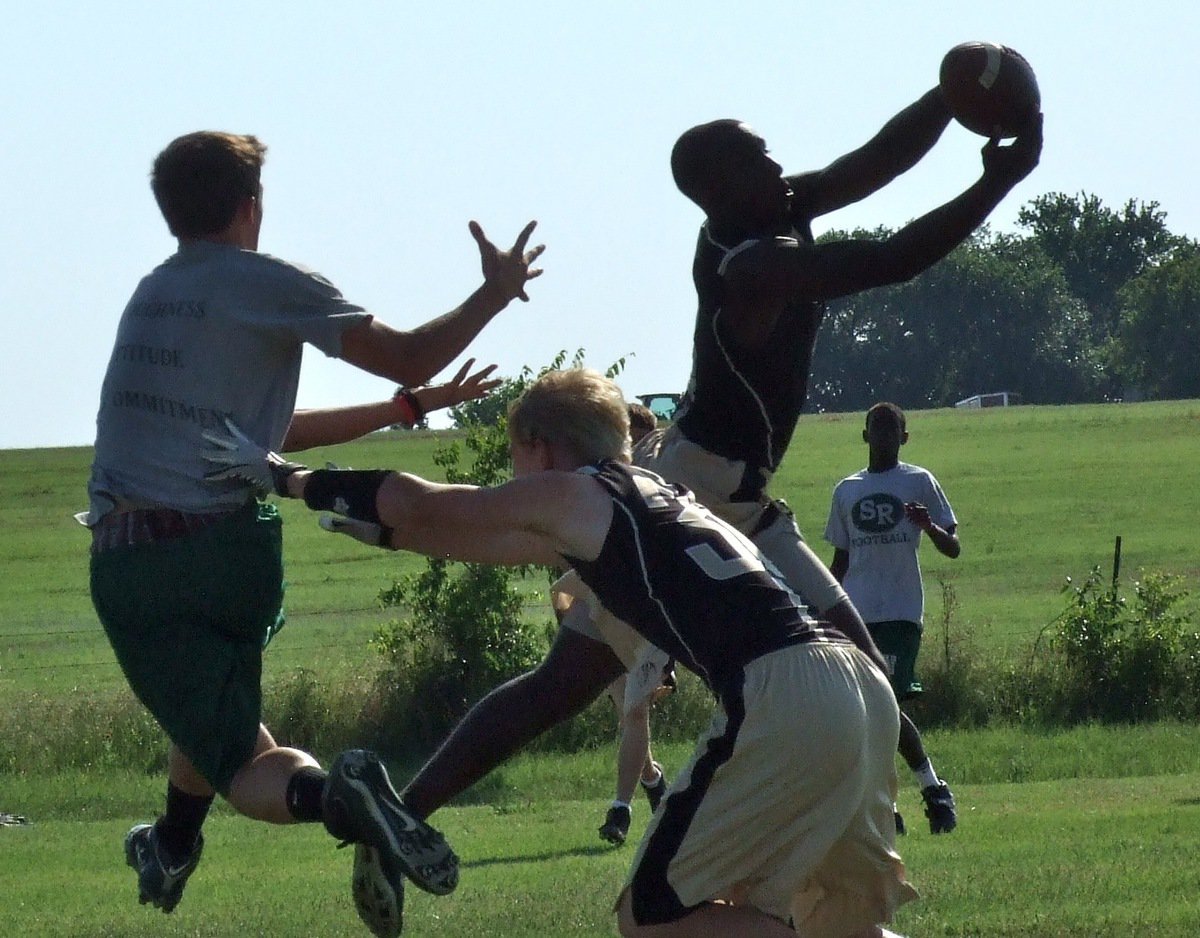 Image: Italy’s Marvin Cox intercepts a Wildcat pass with teammate Cody Boyd assisting on the coverage.