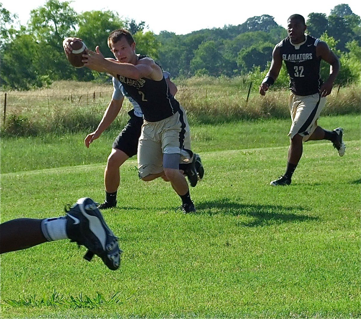 Image: Gladiator Chase Hamilton stretches for extra yards.