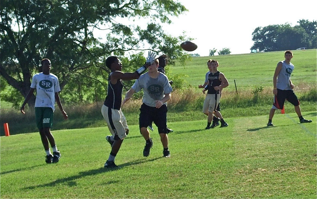 Image: Eric Carson hauls in the touchdown pass.