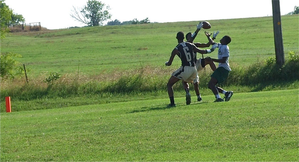 Image: Trevon Robertson and Eric Carson diffuse a Wildcat bomb pass.