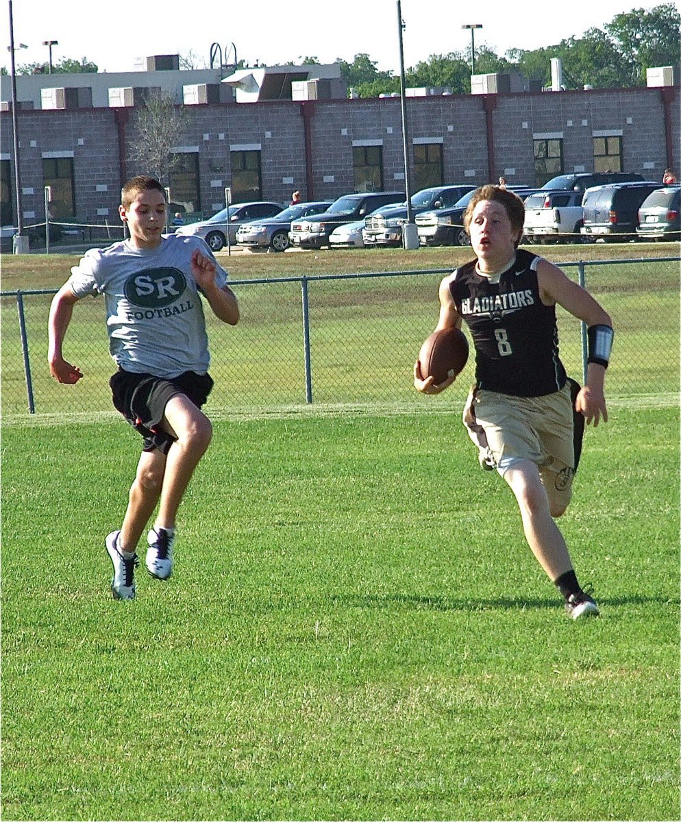 Image: Freshman John Escamilla returns a pick at the goal line 50-yards for a touchdown during the JV finale.