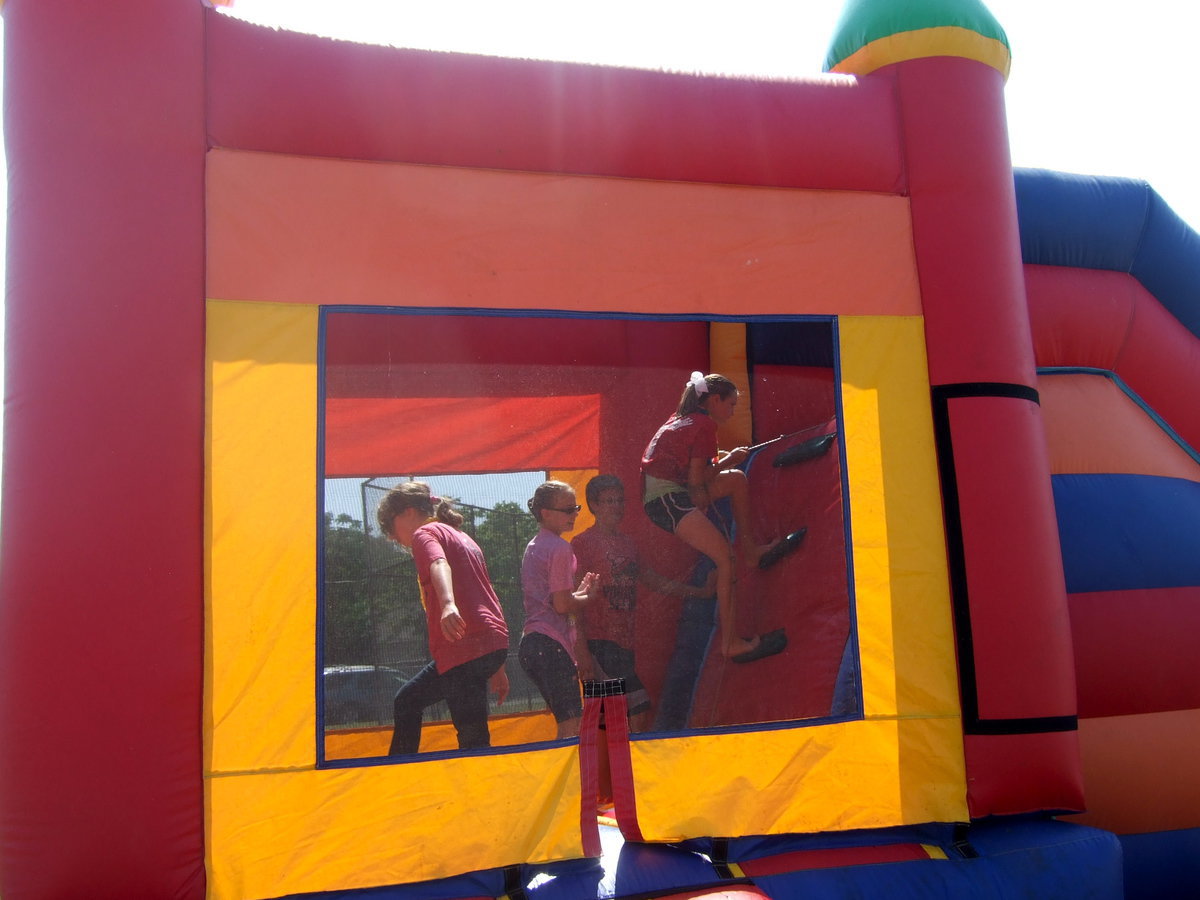 Image: Climbing up the ladder to slide down the slide.