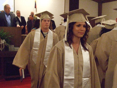 Image: As the graduation class leaves the sanctuary, they realize they are one step closer to beginning their new lives.