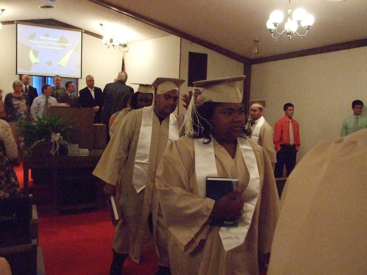 Image: Sa’Kendra Norwood and Juan Perez make their way to the fellowship hall.