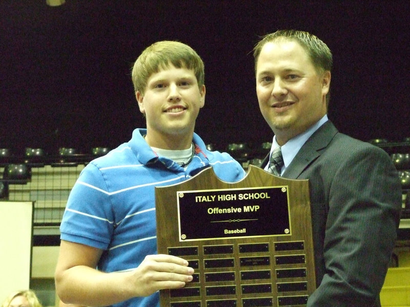 Image: Coach Josh Ward awarded Justin Buchanan the Offensive MVP for baseball.