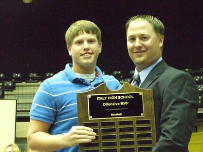 Image: Coach Josh Ward awarded Justin Buchanan the Offensive MVP for baseball.