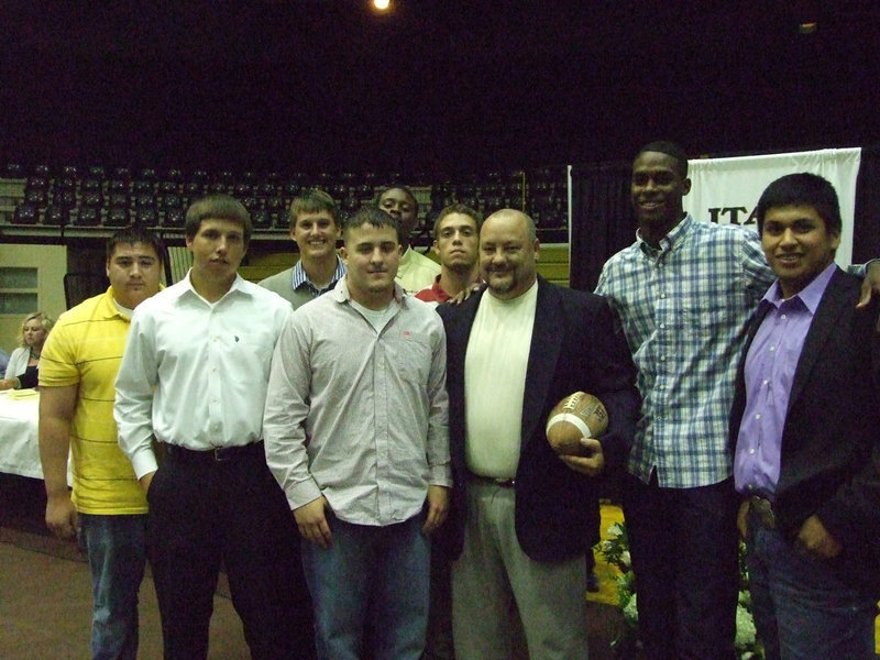 Image: Coach Craig Bales received a team ball from the seniors.