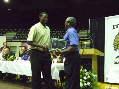 Image: Andrew Henderson awarded Larry Mayberry, Jr the 27th David Henderson Scholarship Award.