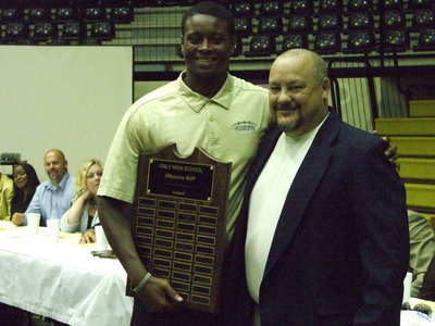 Image: Coach Craig Bales awarded Larry Mayberry, Jr. the Offensive MVP for football.
