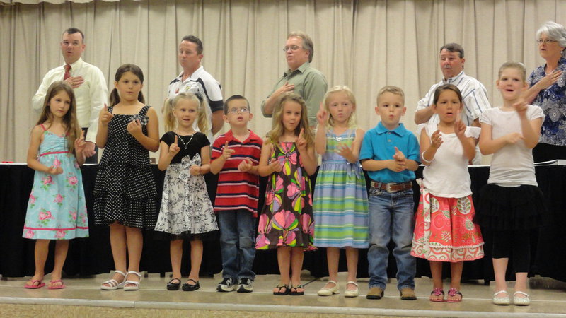 Image: Clover Stiles’ kindergarten class signing the Pledge of Allegiance.  The students were Taylor Souder, Hanah Krusen, Hannah Pajak, Ella Hudson, Mia Droll, Cy Williams, Molly Cusano, Austin Cate and Grace Patton
