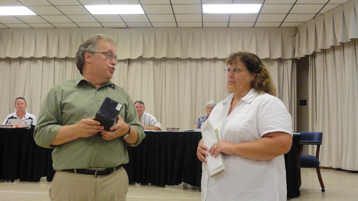 Image: Italy ISD superintendent, Barry Bassett presents Mrs. Seidlitz with a gladiator bobble-head.