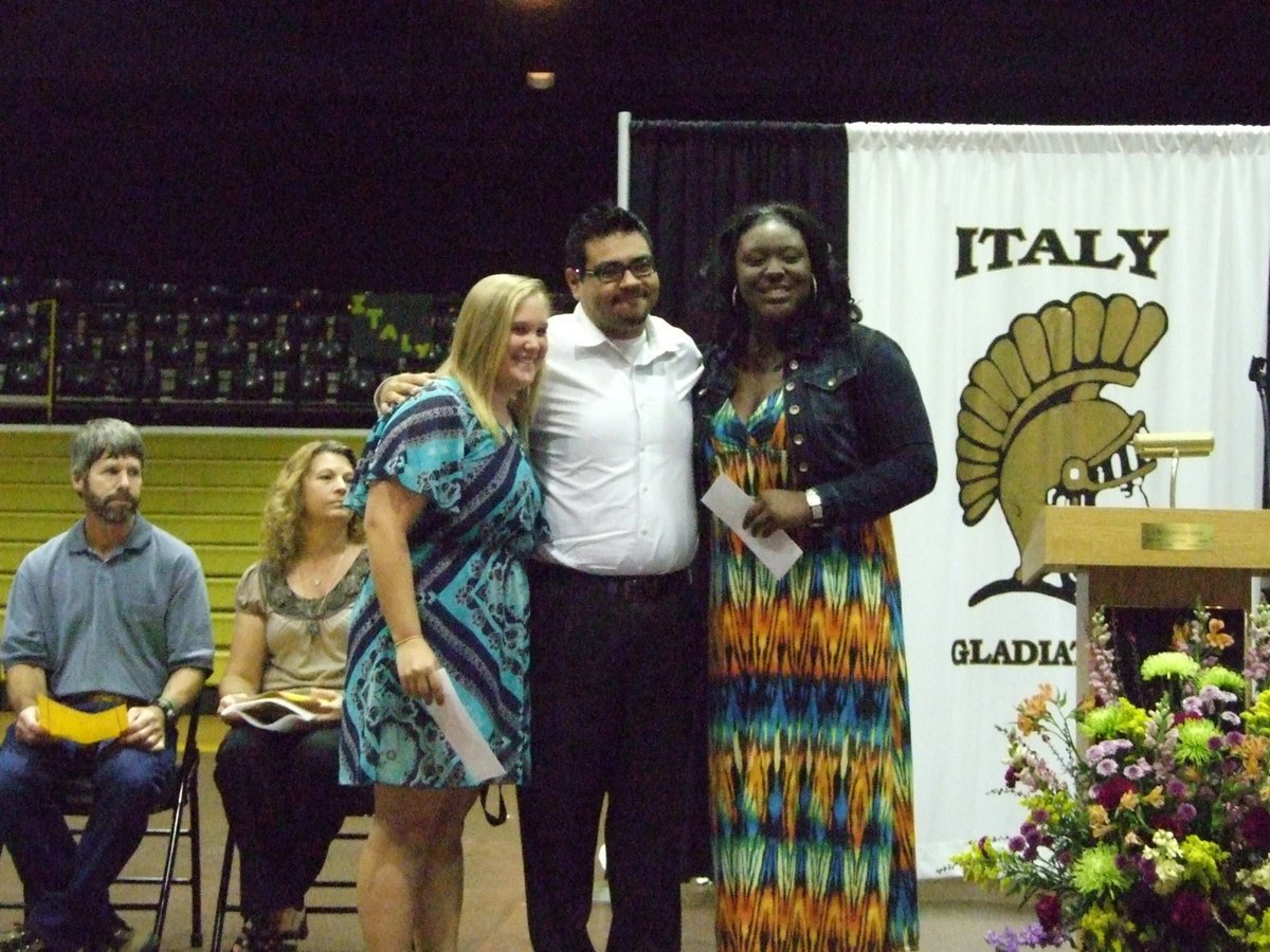 Image: Mr. Perez awarded Band Booster Scholarships to Drenda Burk and Jimesha Reed.