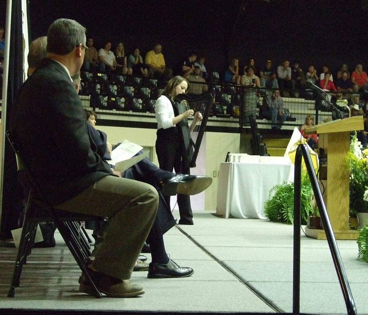 Image: Maddie Pittmon plays the electric autoharp as a gift to the seniors.