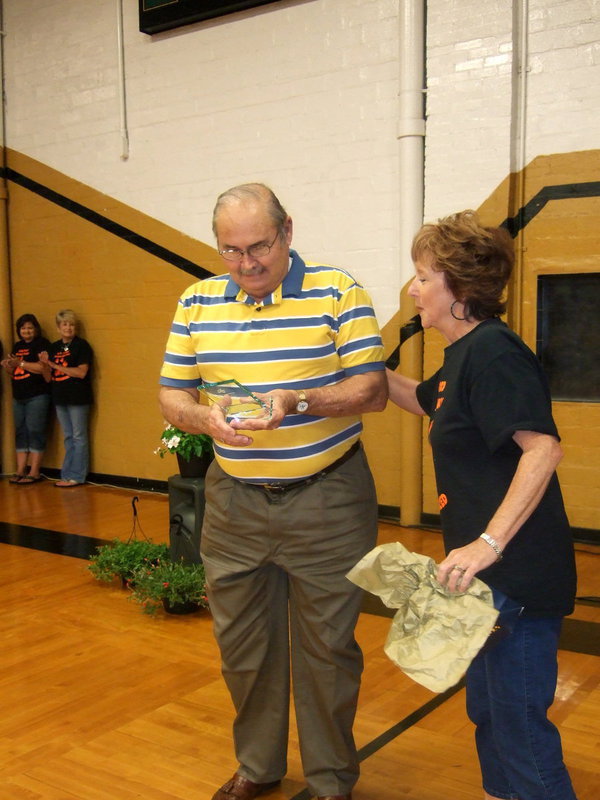 Image: Mr. Ivey receiving his award.