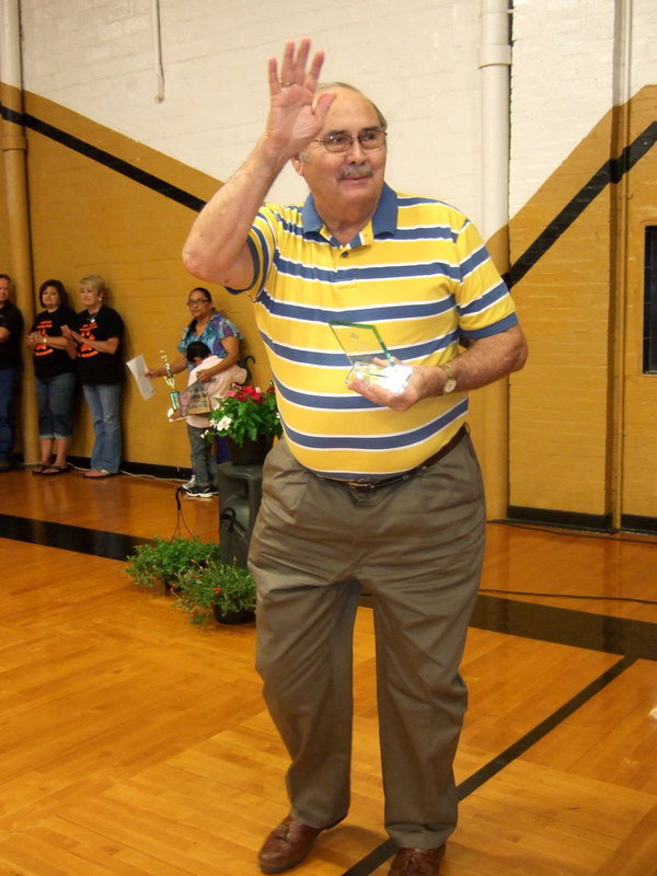 Image: Mr. Ivey waving to the students.