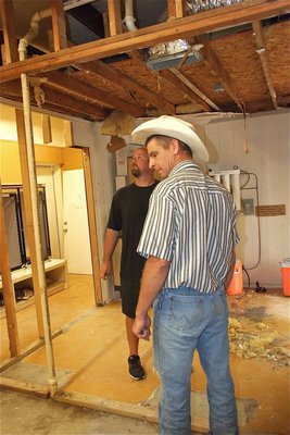 Image: Former Gladiator and current board member, Curtis Riddle, gets a tour of the field house renovations from Coach Hollywood. Riddle, who had two kickoff returns for touchdowns against the Crandle Pirates in 1989, was added to the Golden Hall All-State wall as a senior in 1990 for his defensive accomplishments.